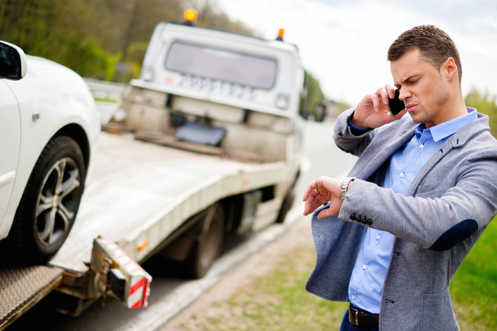 Man Calling While Tow Truck 